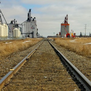 Railway line with grain elevators in the background