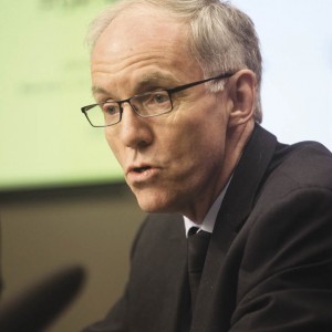 Man speaking at a press conference.