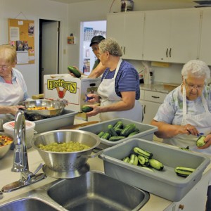 Valley Harvest Maid volunteers methodically slice, dice and sort vegetables in preparation for meals served during Pembina Threshermen’s Reunion Days, August 29 to 31.