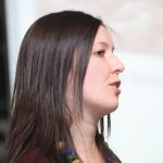 young woman at microphone