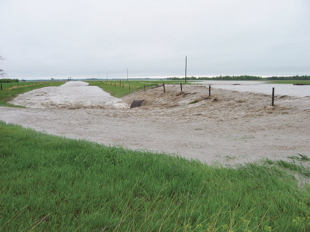 Heavy rain in the Manitoba Escarpment in June 2002 caused flash flooding just west of Miami, Man. Removing natural areas from the escarpment allows water to flow more quickly to the lowlands below.