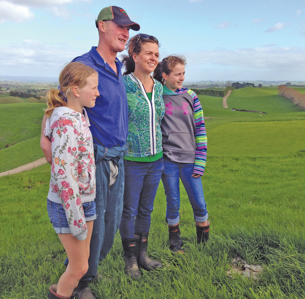Tracy and Wynn Brown stand with two of their four children on their dairy farm in the Waikato region of New Zealand. The farm’s name is Tiroroa, which means, “extensive view.”