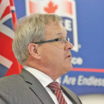 Federal Agriculture Minister Lawrence MacAulay speaks at the Maple Leaf plant in Winnipeg.