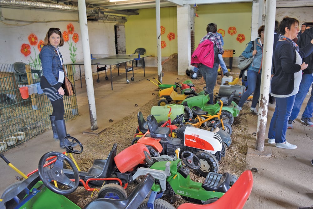 Toy tractors, and games tables have replaced cows in an old dairy shed on the Victor farm. Opening up their farm to vacationers has proven far more lucrative than cows.