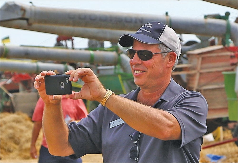 Dave Epp of Canadian Foodgrains Bank was all smiles as he recorded the event.