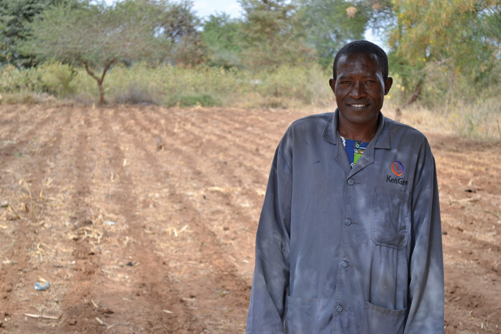 Julius Kitema shares a portion of his land with the Eka Moke Farmers Group for a shared field school (in the background). The land has just been prepared for planting. 