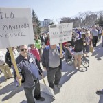People concerned about future flooding on Lake Manitoba protest at the Manitoba legislature.