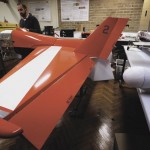 Salah Sukkarieh, professor of robotics and intelligent systems at the University of Sydney, Australian Centre for Field Robotics, stands next to one of his robotic aircraft in his laboratory in Sydney. Australian farmers are increasingly turning to science to maximize yields, with agricultural robots and existing technology a likely future for the average farm. Photo: REUTERS/David Gray 