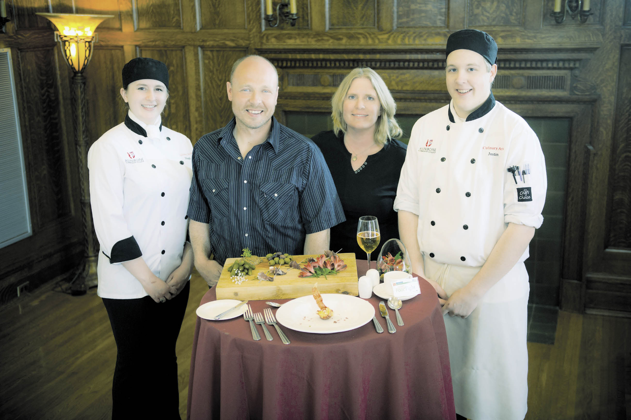 Clinton and Pamela Cavers, centre, were the 2013 gold medalists in the Great Manitoba Food Fight for their pastured pork prosciutto created in their on-farm meat shop. The Cavers were teamed up with Assiniboine Community College’s Manitoba Institute of Culinary Arts student team Maggie Delaurier (l) and Justin Black for the competition.  photo:rob Lovatt / Keywest photo /i mage by design inc.