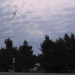 A spray plane flies over a cluster of three yard sites on Aug. 17. photo: Marie Denbow