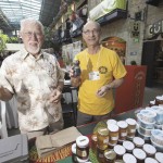 Charles Polcyn (l) and Jim Campbell celebrate the 50th anniversary of the  Red River Apiarists’ Association at the annual honey show at The Forks Market in Winnipeg. Photo: Shannon VanRaes
