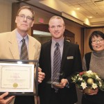 Former Agriculture and Agri-Food Canada wheat breeder Stephen Fox (l) received an honorary life membership in the Canadian Seed Growers Association Dec. 11 at the association’s annual awards banquet in Winnipeg. MSGA president Ryan Murray made the presentation. Fox’s wife Dora was given flowers.  photo: allan dawson