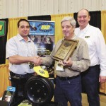Last year Mark Devloo’s (left) Roto Mud Scraper won the Inventor’s Showcase and he’s back this year with a slightly improved version. He’s received the award from Jim Affleck of the Manitoba Co-operator, which sponsors the award.
