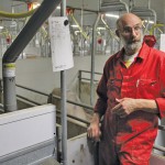 Gerbert Oosterlaken standing in a production facility.