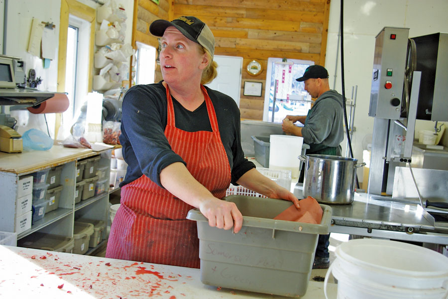 Woman making proscuitto