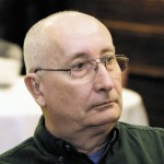 Mature man wearing glasses.