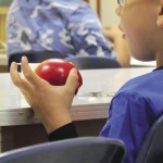 boy eating an apple
