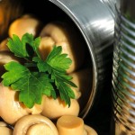Open cans of mushrooms.