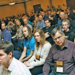 People seated in an auditorium.