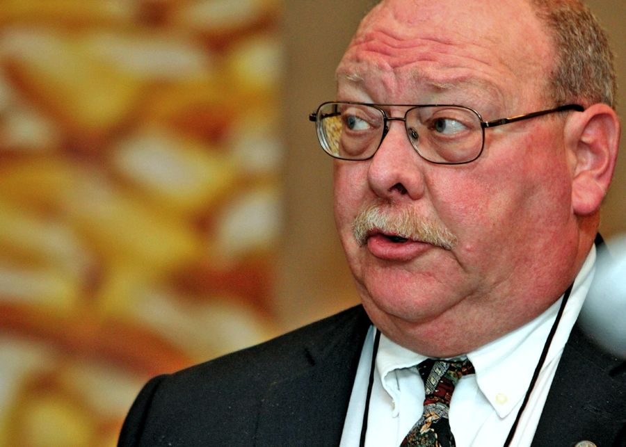 Man making a speech at conference.