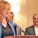 Woman making a speech at podium.