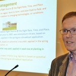 Man presenting with a podium microphone.