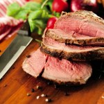 Medium Rare Beef Roast Served with Various Vegetables