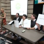 People sitting at a conference table.