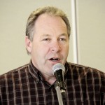 Man speaking into microphone