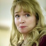 Woman with long blonde hair.