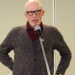 Man speaking into microphone