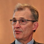 Mature man wearing glasses.