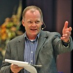 Man presenting at a conference.