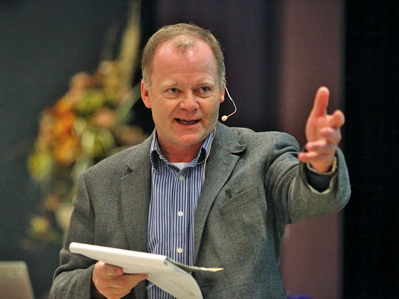 Man presenting at a conference.