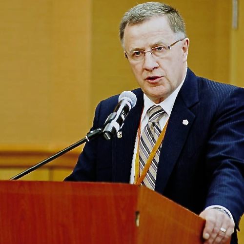 Man speaking at a podium.