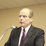Man speaking at microphone