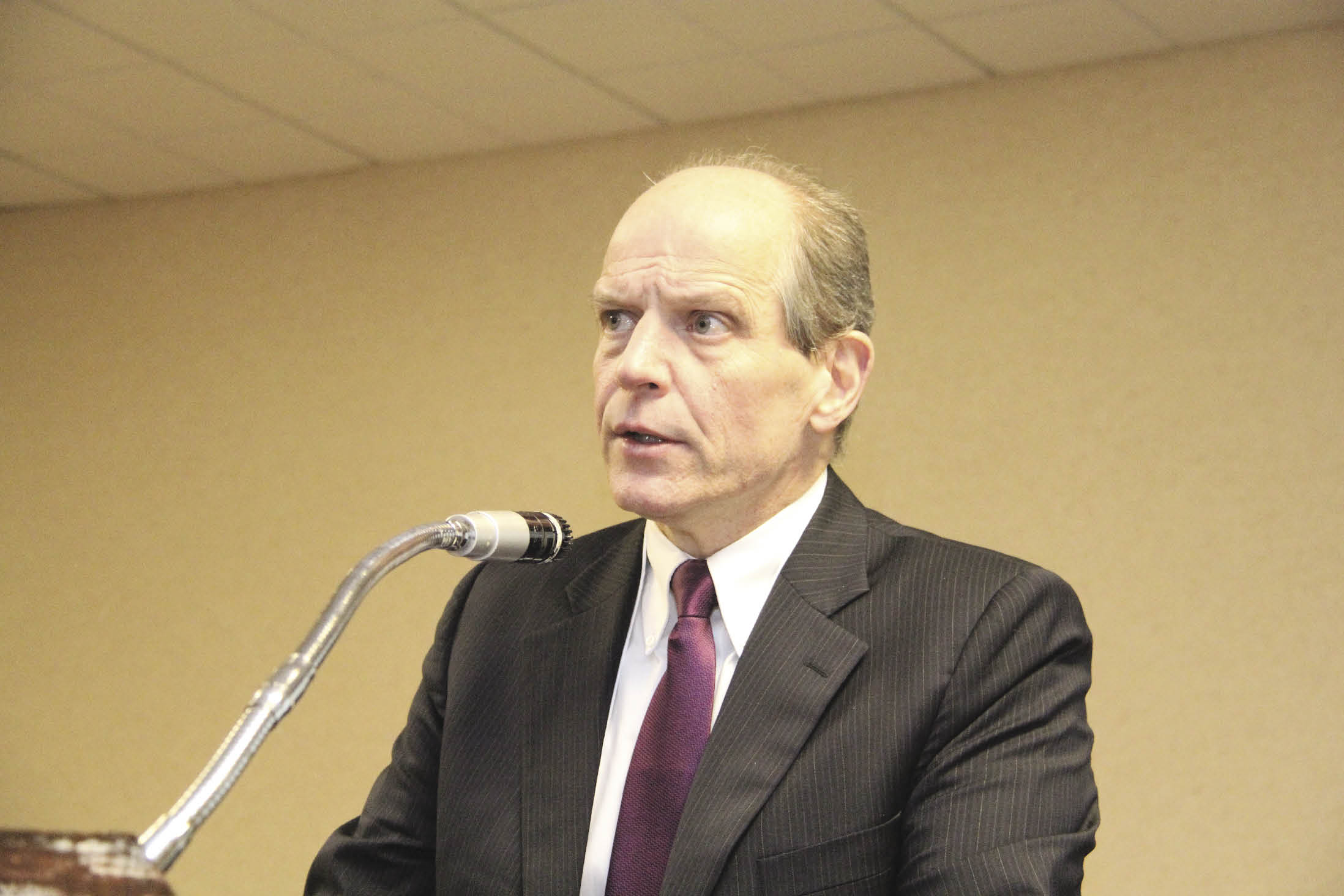 Man speaking at microphone
