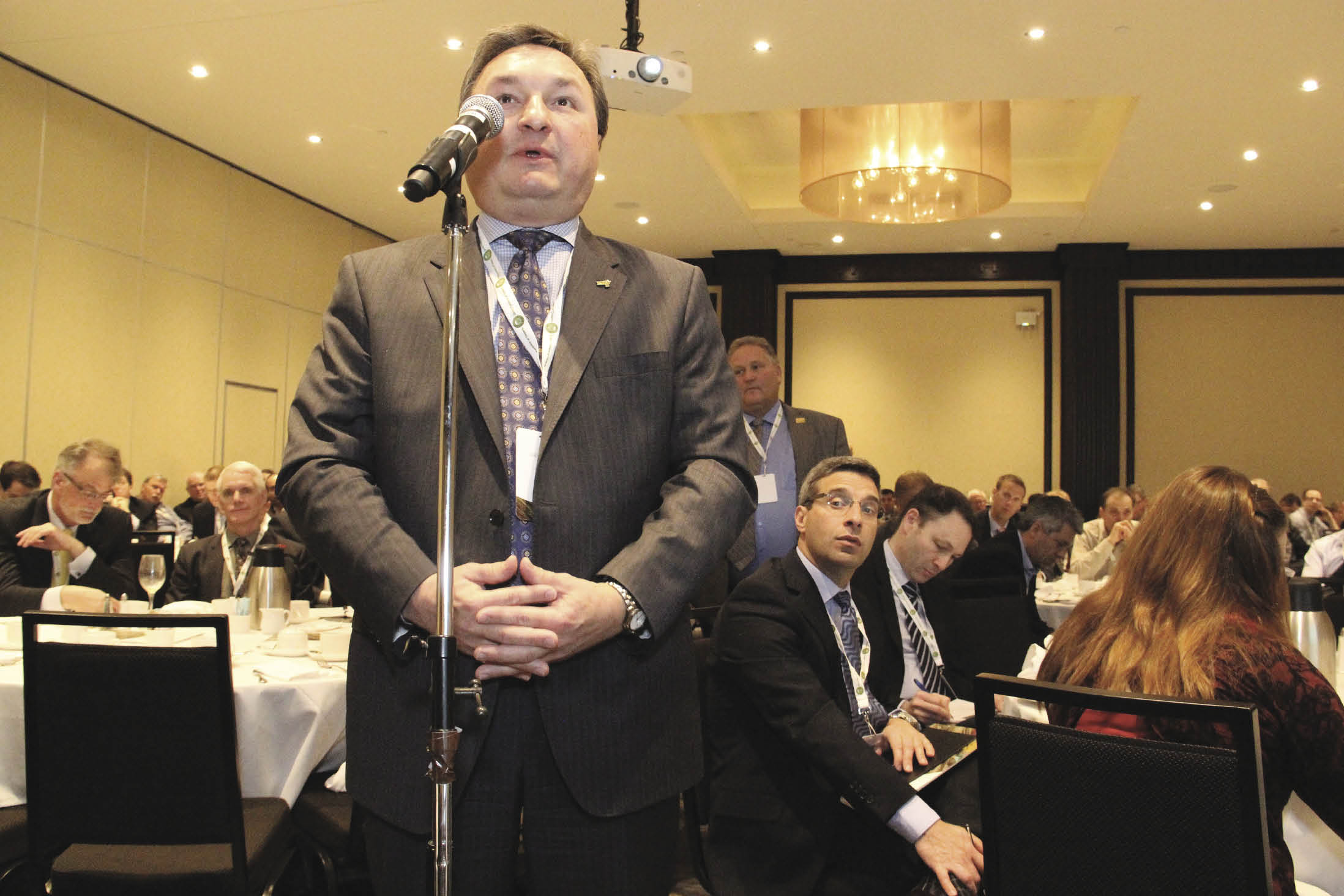 Man speaking into microphone.