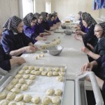 Hutterite women gather to make graua knedel mit schmagus (grey dumplings with white sauce also known as washing-machine dumplings).