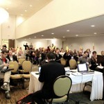 People sitting in a conference room.