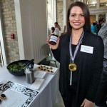 Woman holding jar of jam.