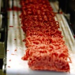ground beef on a conveyor