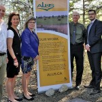 people standing by a promo banner