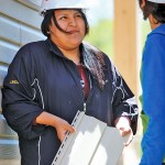 young woman helping build a house
