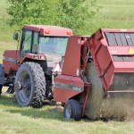 Although late, Manitoba’s first-cut hay is mostly up now and yielded well outside of the flood area, says John McGregor of the Manitoba Forage and Hayland Association. This field was being baled near Miami July 29. photo: allan dawson