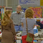 Randy Eros speaks with customers at the Manitoba Fibre Festival.