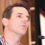 man speaking at a conference