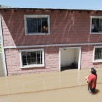 Residents are seen inside their flooded home in Pilar, northern Buenos Aires, November 5, 2014. Days of torrential rainfall leads to extensive flooding which causes property damage prompting thousands of evacuations in Buenos Aires province.