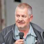 man at auction with microphone in his hand