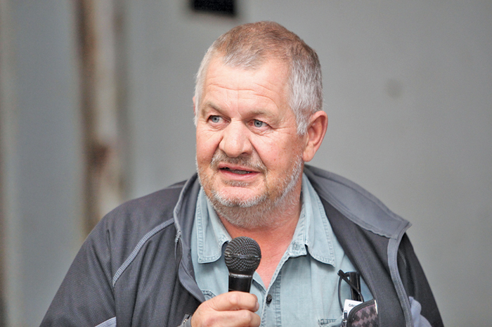 man at auction with microphone in his hand